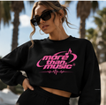 Model wearing a black cropped sweatshirt with pink More Than Music logo